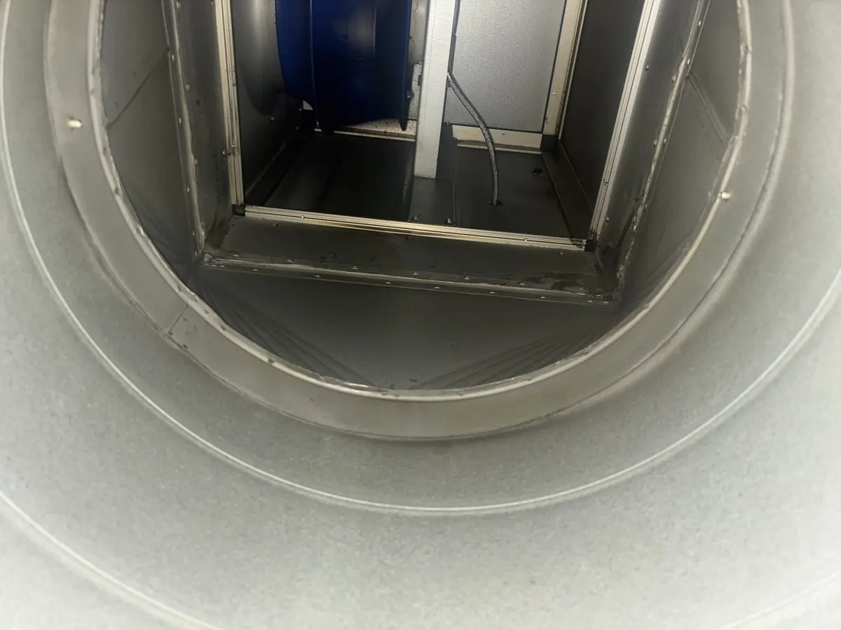 Oval discharge ductwork rising to roof termination, cleaned